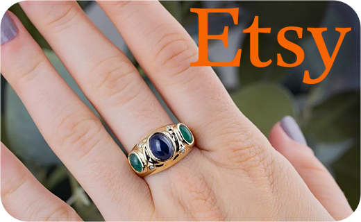 One of our new Etsy rings with sapphire and emeralds being worn