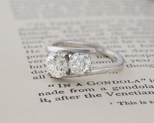 Custom Two Stone Asymmetrical Engagement Ring side view on book