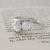 Custom Two Stone Asymmetrical Engagement Ring side view on book