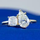 Two stone ring with pear and cushion cut lab diamond on yellow gold setting front