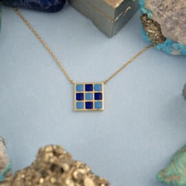 Blue Checkered Enamel Necklace in 14 karat Yellow Gold with cable chain posed front.