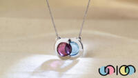 Union articulating pendant with rhodolite garnet and blue topaz