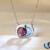 Union articulating pendant with rhodolite garnet and blue topaz