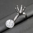 Solitaire ring mounting with loose diamond next to it